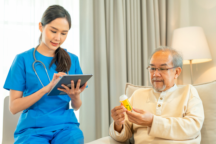 Care team member providing transitional care to a patient at home