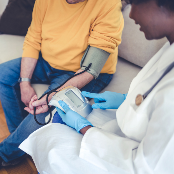 Clinician providing transitional care services to patient at home