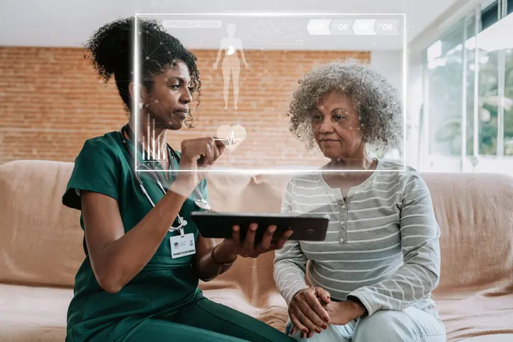 Peer support specialist engaging with a patient during post-discharge recovery as part of transitional care success metrics